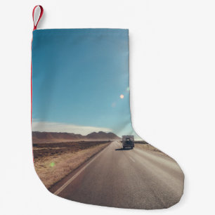 Car on black asphalt road small christmas stocking