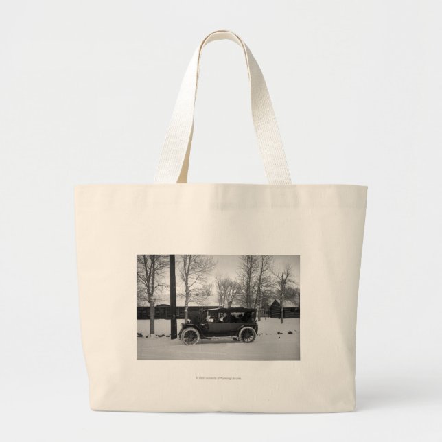 Car with Christmas tree tied on the hood Large Tote Bag (Front)