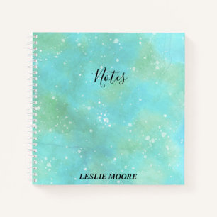 Carnet Aquarelle turquoise avec des notes en blanc