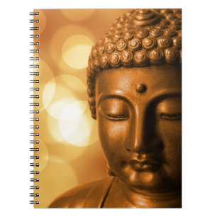 Carnet Bronze Buddha Statue with Golden Bokeh Background