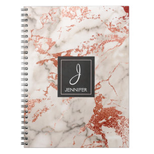 Carnet de marbre rose de monogramme d'or