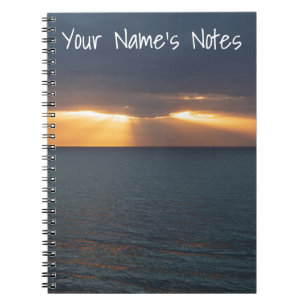Carnet Les rayons du soleil couchant de la mer percevant