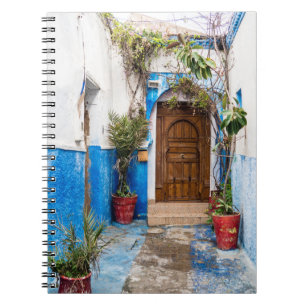 CARNET PLANTE VERT EN FEUX PRÈS DU MUR