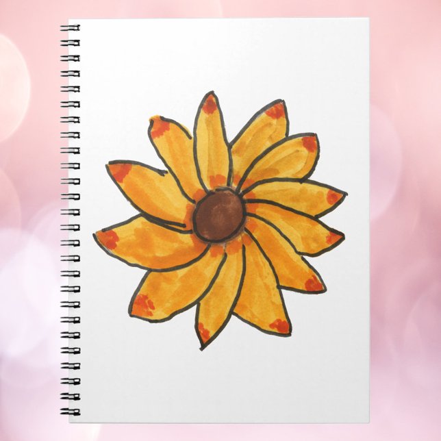 Carnet Tournesol Encre Jaune Main Tirée (A notebook with a hand drawn sunflower with red and orange tips.)
