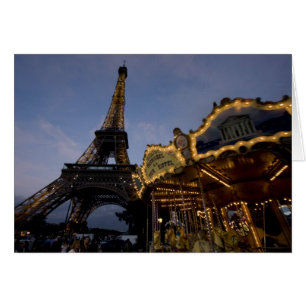 Carousel by the Eiffel Tower in the evening,