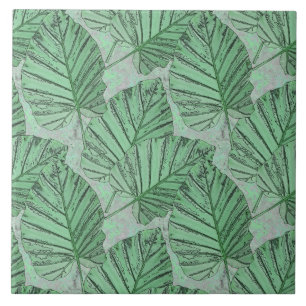 Carreau Des feuilles verts sur une pierre grise.