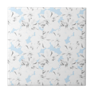Carreau Fleurs blanches sur bleu clair.