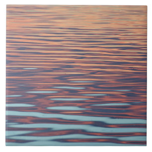 Carreau Ondes de coucher de soleil sur l'eau