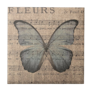 Carreau Papillon bleu sur la musique de feuille vintage