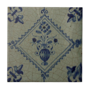 Carreau Tuile bleue de Delft - vase avec les fleurs et le