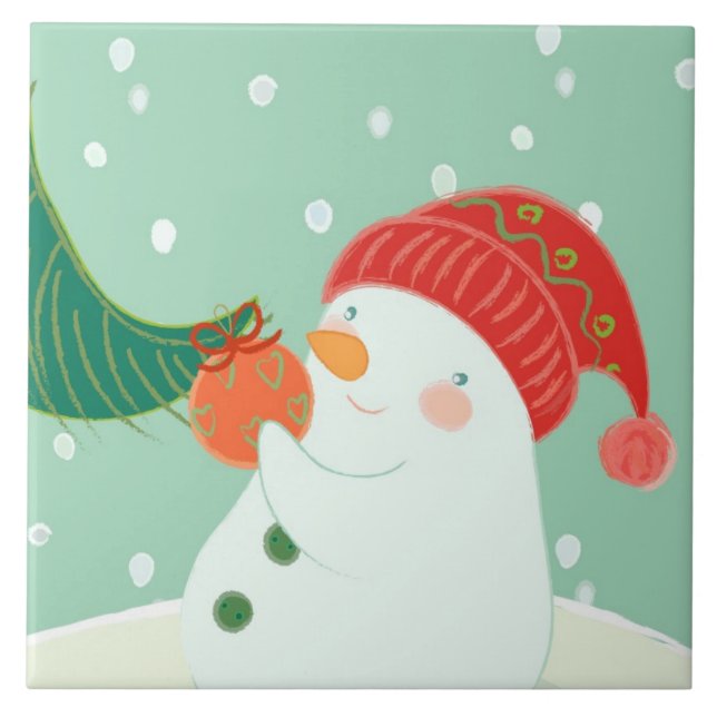 Carreau Un bonhomme de neige accrochant un ornement sur un (Devant)