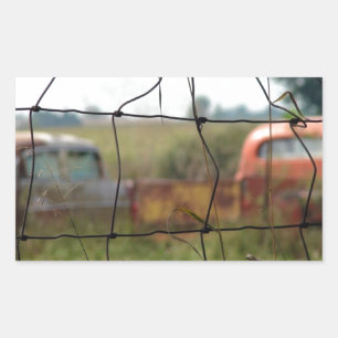Cars and Trucks Rust Away in a Rural Field Sticker