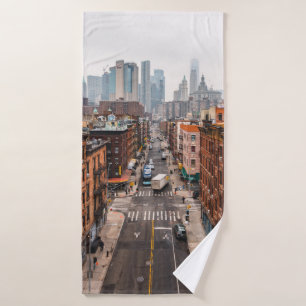 CARS ON ROAD BETWEEN HIGH RISE BUILDINGS DURING DA BATH TOWEL