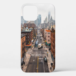 CARS ON ROAD BETWEEN HIGH RISE BUILDINGS DURING DA iPhone 12 CASE
