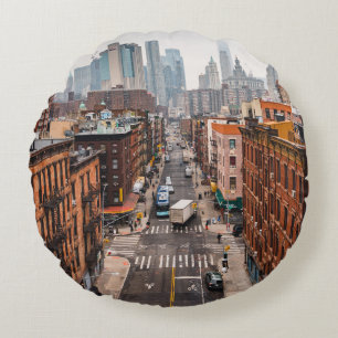 CARS ON ROAD BETWEEN HIGH RISE BUILDINGS DURING DA ROUND PILLOW
