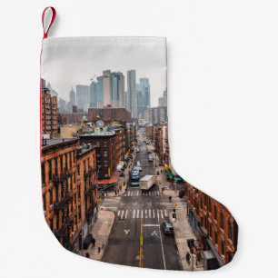 CARS ON ROAD BETWEEN HIGH RISE BUILDINGS DURING DA SMALL CHRISTMAS STOCKING
