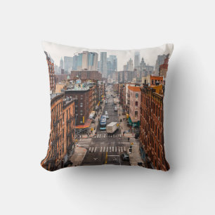 CARS ON ROAD BETWEEN HIGH RISE BUILDINGS DURING DA THROW PILLOW