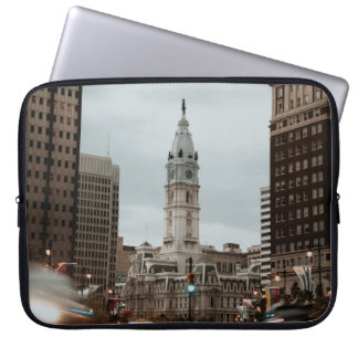 CARS ON ROAD NEAR HIGH RISE BUILDINGS DURING DAYTI LAPTOP SLEEVE