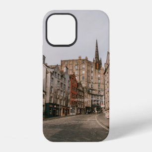 CARS PARKED BESIDE BROWN CONCRETE BUILDING DURING iPhone 12 CASE