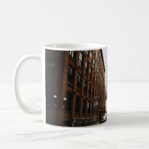 CARS PARKED NEAR BROWN BUILDING COFFEE MUG