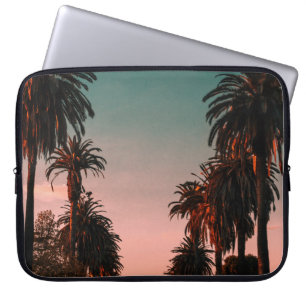 Cars parked on grey concrete near trees laptop sleeve