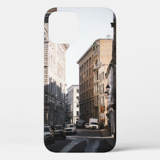 CARS PARKED ON SIDE OF THE ROAD IN BETWEEN BUILDIN iPhone 12 CASE