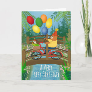 Carte Anniversaire à vélo dans un parc avec des ballons