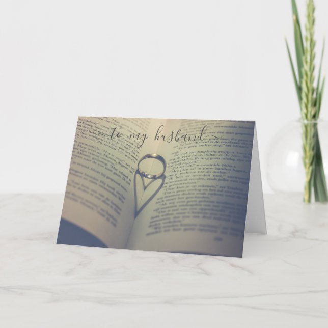 Carte Bague de mariage sur un livre ouvert anniversaire  (Devant)