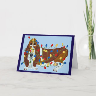 Carte Basset Hound empêtré dans les lumières de Noël