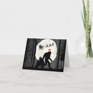 Carte Bigfoot drôle de Noël avec le Père Noël dans la fo