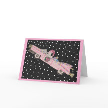 Caniche à Noël dans une décapotable rose