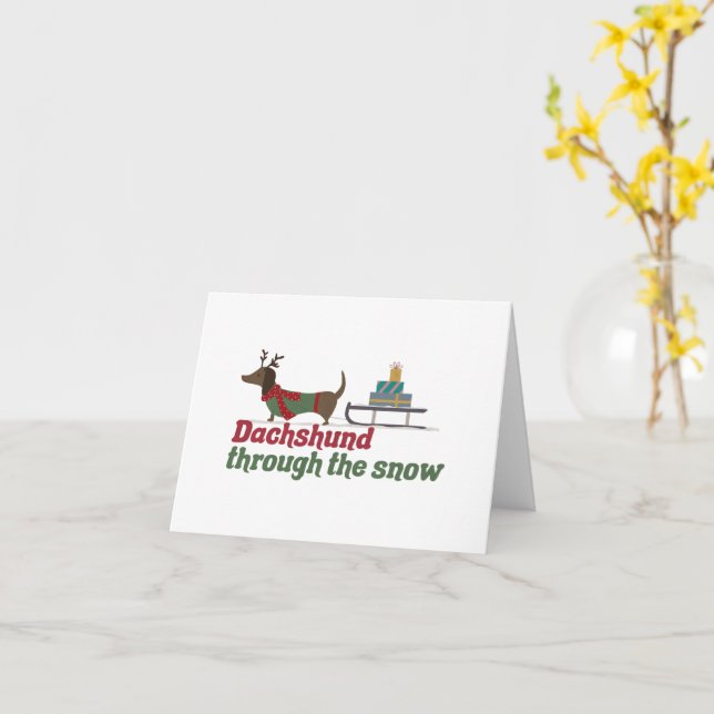 Carte Canon de Noël : Dachshund à travers la neige (Fleur jaune)