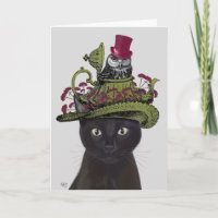 Chat noir avec théière et hibou