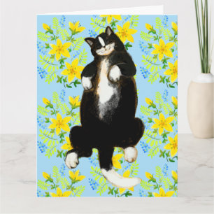 Carte Chat smoking dormant sur un lit floral