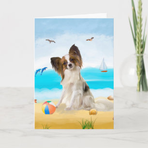 Carte Chien de Papillon sur la plage 