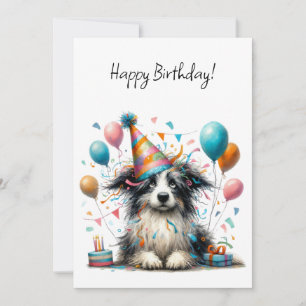Carte Chien noir et blanc avec un chapeau de fête d'anni
