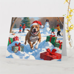 Carte Chien Pitbull courant dans la neige avec un chapea