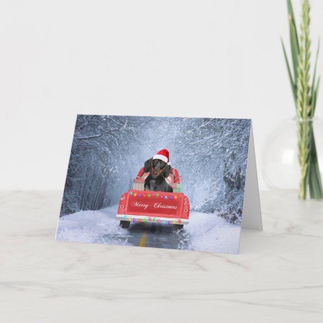 Carte Chien teckel dans la neige assis dans un camion de (Devant)