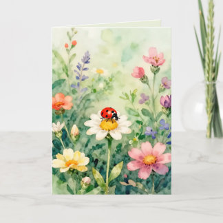 Carte Coccinelle dans un jardin de fleurs