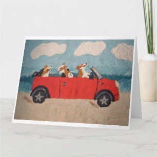 Carte Corgis gallois dans un cabriolet rouge à la plage