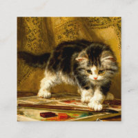 Kitten avec peinture et brosses