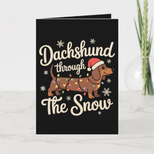 Carte Dachshund à travers la neige Chien Lumières de Noë