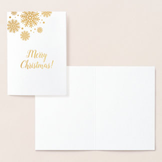 Carte de Noël avec flocons d'or et texte.