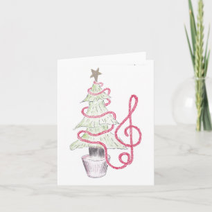 Carte de Noël en forme de clé de sol avec des guir