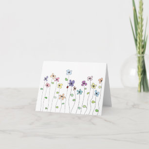 Carte de note pliée avec fleurs dessinées à la mai