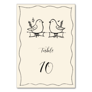 Carte de numéro de table de mariage dessinée à la