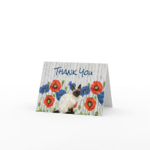 Poppies rouges et bleues avec chat siamois