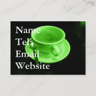 Carte De Visite Coupe de café vert sur une table noire