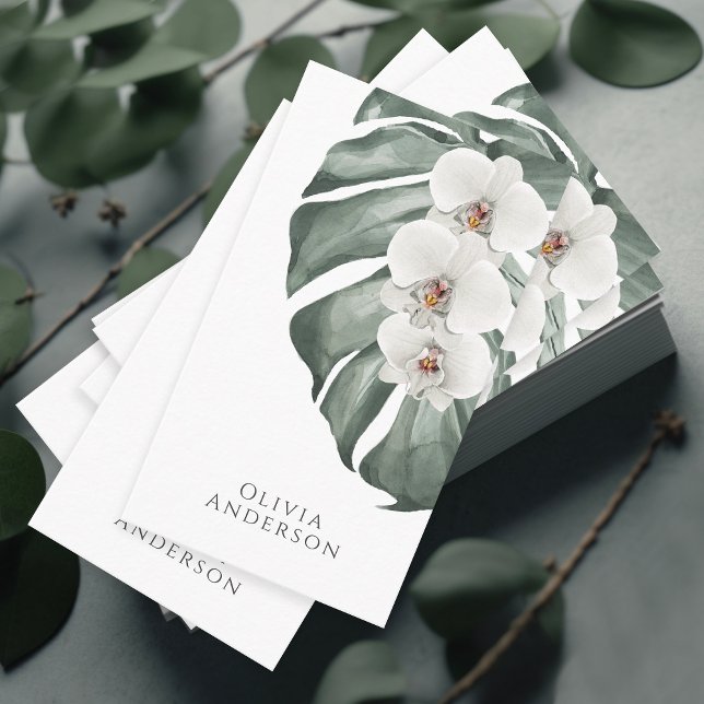 Carte De Visite Orchidées blanches sur Monstera Tropical Botanical (A stunning business card with a tropical elegance featuring white orchids on a monstera leaf.)