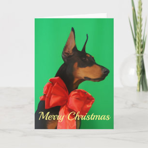 Carte Dobermann Potrait avec l'arc rouge de Noël
